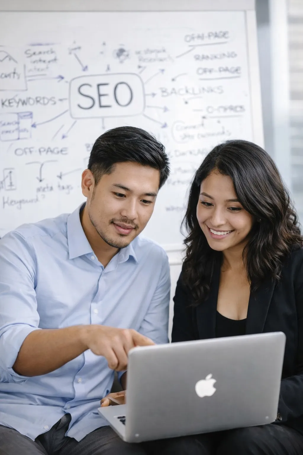 SEO specialists collaborating on search strategy and performance analysis